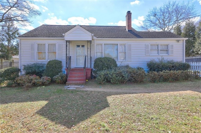 ranch-style home with a front yard