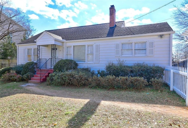 back of house with a yard