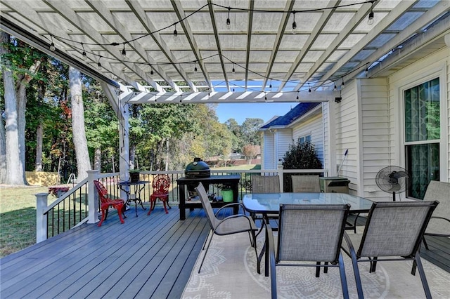 wooden deck featuring area for grilling and a pergola