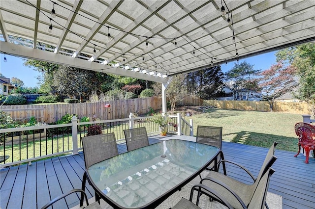 deck with a pergola and a lawn