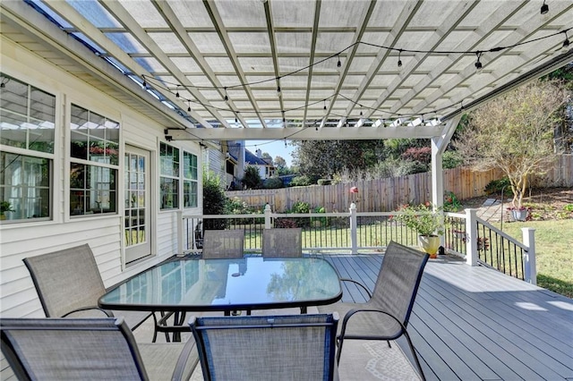 wooden terrace featuring a pergola and a yard