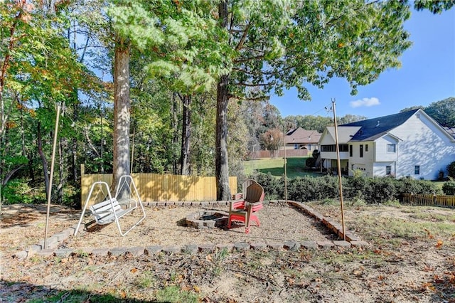 view of yard with an outdoor fire pit