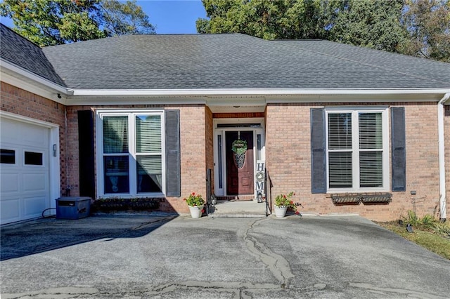 view of exterior entry featuring a garage