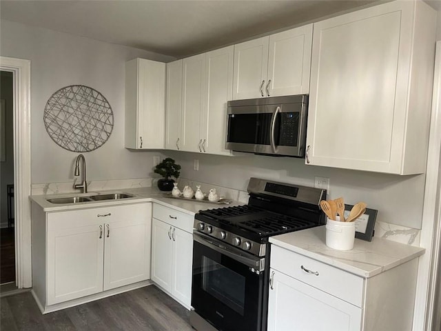 2135 Niskey Lake Rd SW, Atlanta, GA 30331 - kitchen featuring white cabinetry, appliances with stainless steel finishes, a sink, and dark wood finished floors