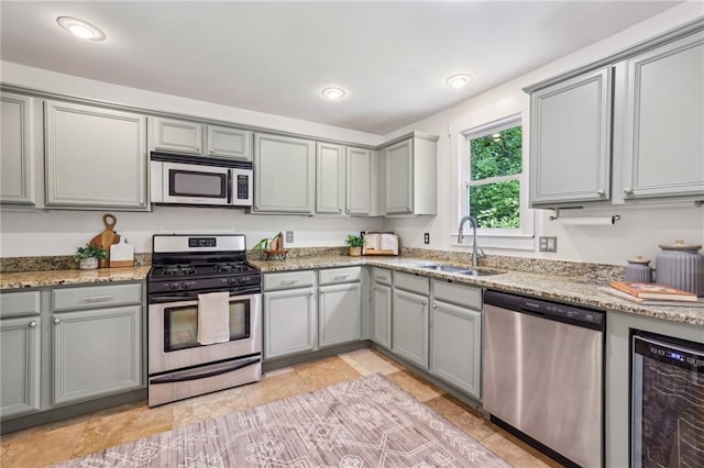 1592 Braeburn Dr SE, Atlanta, GA 30316 - kitchen with stainless steel appliances, gray cabinets, a sink, and recessed lighting