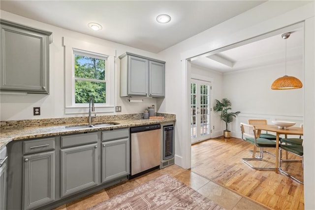 1592 Braeburn Dr SE, Atlanta, GA 30316 - kitchen featuring stainless steel dishwasher, a sink, gray cabinetry, wine cooler, and light stone countertops