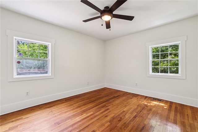 1592 Braeburn Dr SE, Atlanta, GA 30316 - spare room with baseboards, wood-type flooring, and ceiling fan
