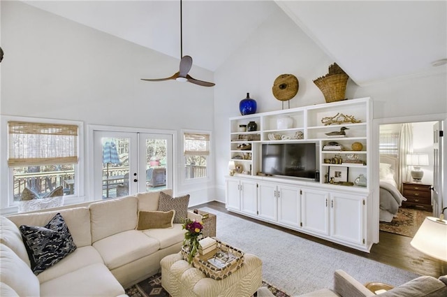 living room featuring french doors, ceiling fan, dark hardwood / wood-style flooring, and high vaulted ceiling