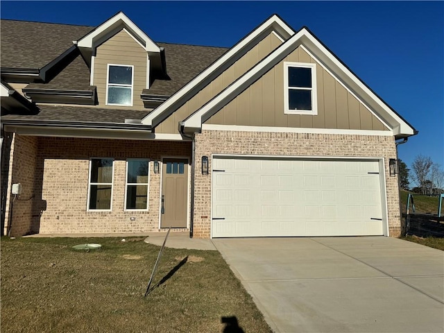 craftsman-style home featuring a garage and a front yard