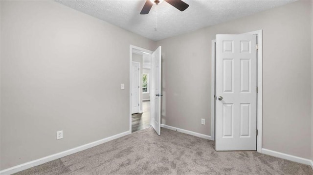 35 Ravenwood Dr, Rockmart, GA 30153 - unfurnished bedroom with a textured ceiling, carpet, and ceiling fan