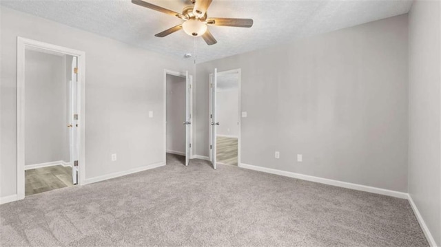 35 Ravenwood Dr, Rockmart, GA 30153 - unfurnished bedroom featuring carpet flooring, a textured ceiling, a ceiling fan, and connected bathroom