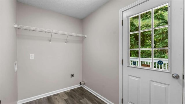 35 Ravenwood Dr, Rockmart, GA 30153 - laundry room with hookup for an electric dryer, dark wood-type flooring, healthy amount of natural light, and a textured ceiling