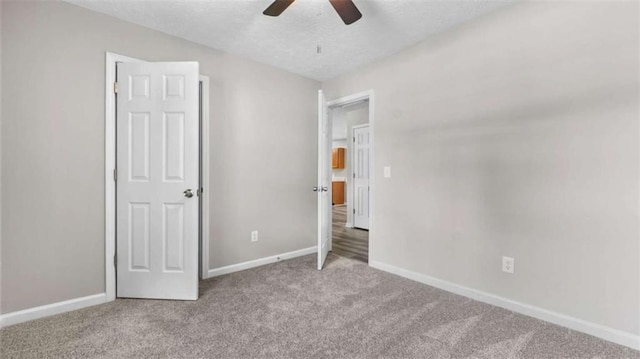 35 Ravenwood Dr, Rockmart, GA 30153 - unfurnished bedroom featuring carpet flooring, a textured ceiling, and ceiling fan