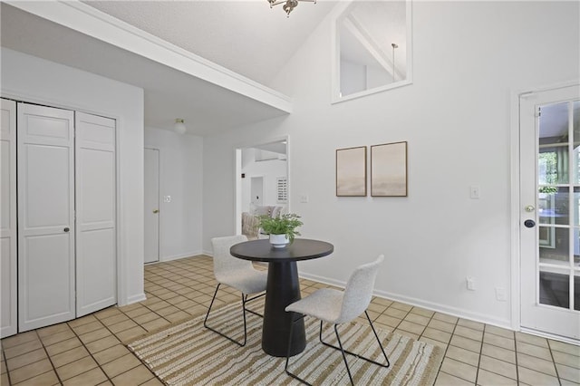 402 Roswell Green Ln, Roswell, GA 30075 - dining space featuring light tile patterned flooring, baseboards, and high vaulted ceiling