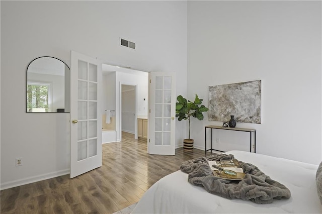 402 Roswell Green Ln, Roswell, GA 30075 - bedroom featuring french doors, wood finished floors, baseboards, and a high ceiling