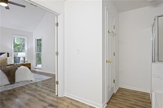 402 Roswell Green Ln, Roswell, GA 30075 - bedroom featuring wood finished floors, baseboards, vaulted ceiling, and ceiling fan