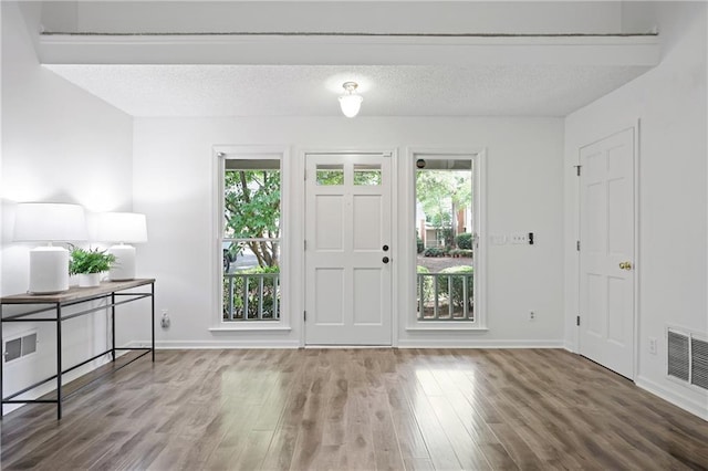 402 Roswell Green Ln, Roswell, GA 30075 - foyer entrance with wood finished floors, baseboards, and a textured ceiling