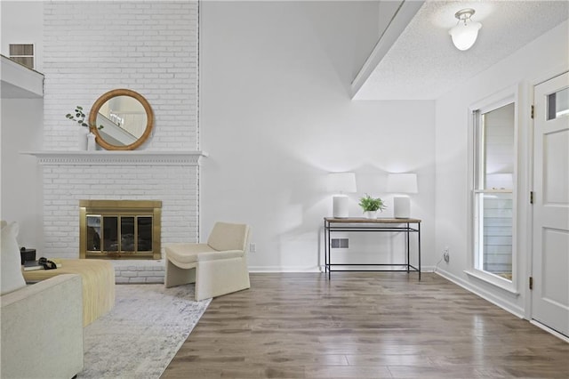 402 Roswell Green Ln, Roswell, GA 30075 - living area featuring wood finished floors, a fireplace, and baseboards