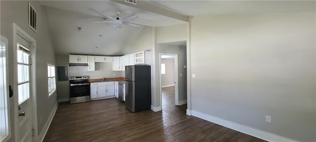 kitchen with white cabinets, stainless steel appliances, baseboards, visible vents, and high vaulted ceiling