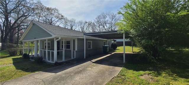 2917 Joe Jerkins Blvd, Austell, GA 30106 - rear view of house featuring driveway, a lawn, a carport, and roof with shingles