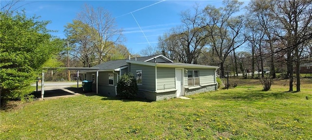 2917 Joe Jerkins Blvd, Austell, GA 30106 - view of home's exterior with a lawn and an attached carport