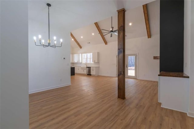 1250 Hays Mill Rd, Carrollton, GA 30117 - unfurnished living room with a chandelier, high vaulted ceiling, beam ceiling, light wood finished floors, and baseboards