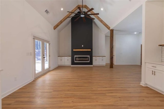 1250 Hays Mill Rd, Carrollton, GA 30117 - unfurnished living room with ceiling fan, high vaulted ceiling, light wood-type flooring, a fireplace, and baseboards