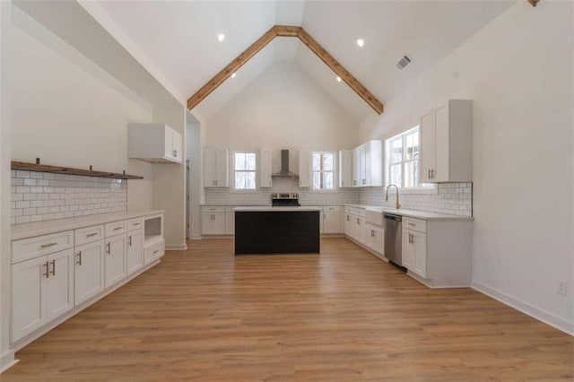1250 Hays Mill Rd, Carrollton, GA 30117 - kitchen with wall chimney exhaust hood, appliances with stainless steel finishes, high vaulted ceiling, tasteful backsplash, and a sink