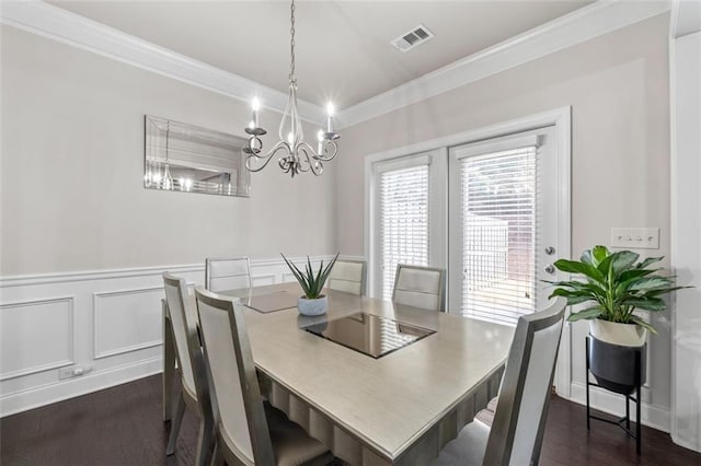 dining space featuring crown molding and dark hardwood / wood-style flooring