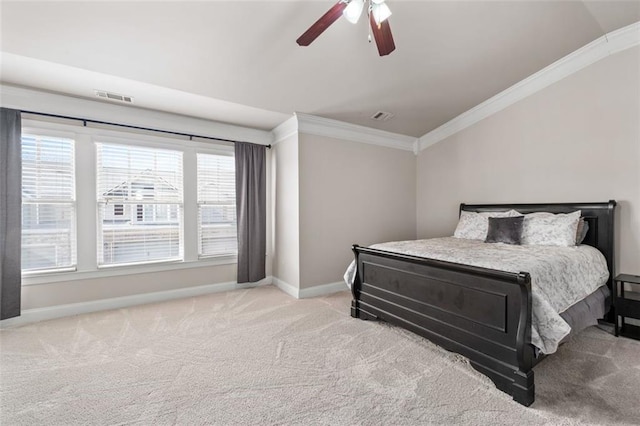 bedroom featuring crown molding, lofted ceiling, light colored carpet, and ceiling fan