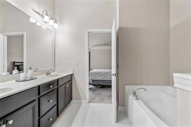 bathroom with vanity and a bath