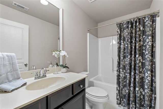 full bathroom with vanity, toilet, and shower / tub combo with curtain