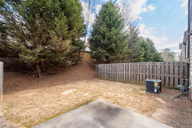 view of yard featuring a patio and central AC unit