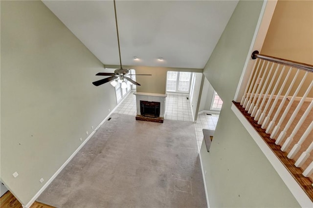3426 Olivia Grace Way, Dacula, GA 30019 - unfurnished living room featuring ceiling fan, baseboards, stairs, carpet, and a fireplace