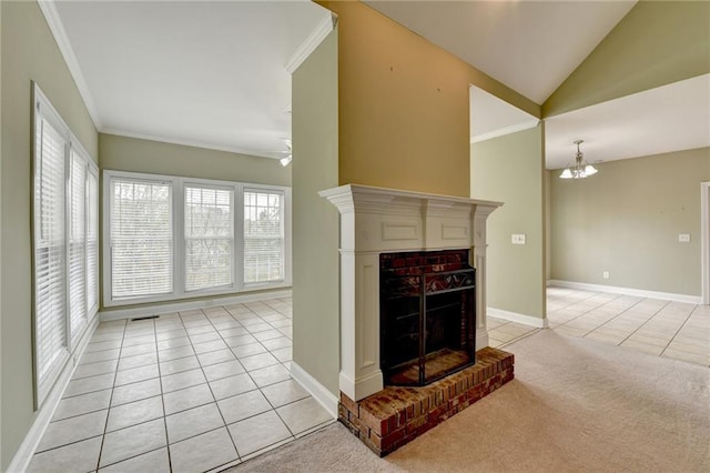 3426 Olivia Grace Way, Dacula, GA 30019 - unfurnished living room with light tile patterned flooring, crown molding, a brick fireplace, vaulted ceiling, and light colored carpet