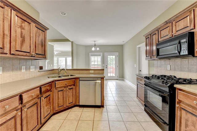 3426 Olivia Grace Way, Dacula, GA 30019 - kitchen with black appliances, a sink, brown cabinets, decorative backsplash, and recessed lighting