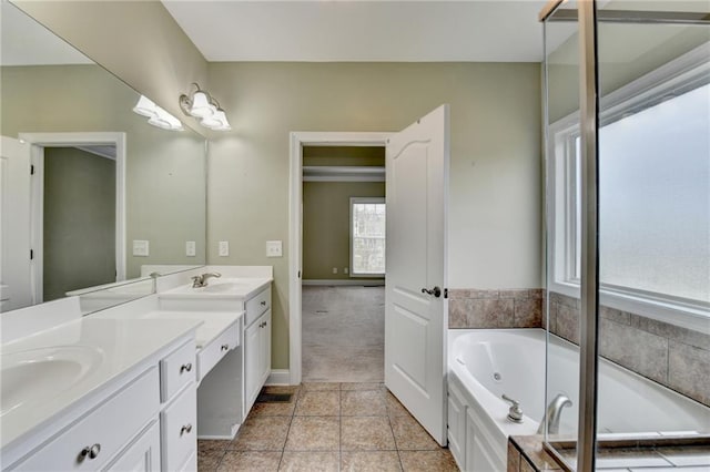 3426 Olivia Grace Way, Dacula, GA 30019 - bathroom featuring double vanity, a whirlpool tub, and tile patterned flooring