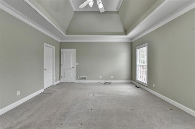 3426 Olivia Grace Way, Dacula, GA 30019 - unfurnished room with carpet flooring, ceiling fan, a tray ceiling, baseboards, and crown molding
