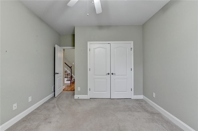 3426 Olivia Grace Way, Dacula, GA 30019 - unfurnished bedroom with carpet, baseboards, a closet, and ceiling fan
