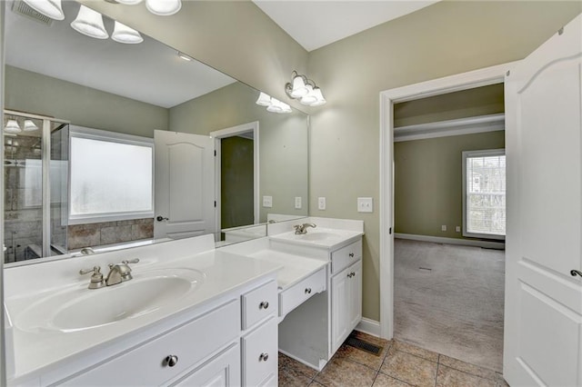 3426 Olivia Grace Way, Dacula, GA 30019 - full bathroom with double vanity, a tile shower, and baseboards