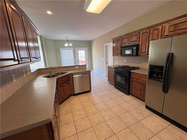3426 Olivia Grace Way, Dacula, GA 30019 - kitchen featuring black appliances, a sink, a chandelier, decorative backsplash, and light tile patterned flooring