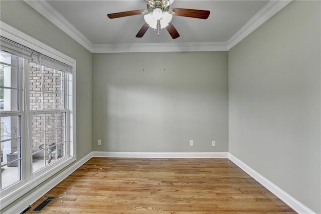 3426 Olivia Grace Way, Dacula, GA 30019 - empty room featuring light wood-style flooring, ornamental molding, baseboards, and ceiling fan