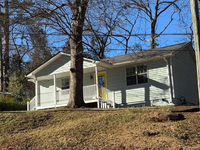 single story home featuring covered porch