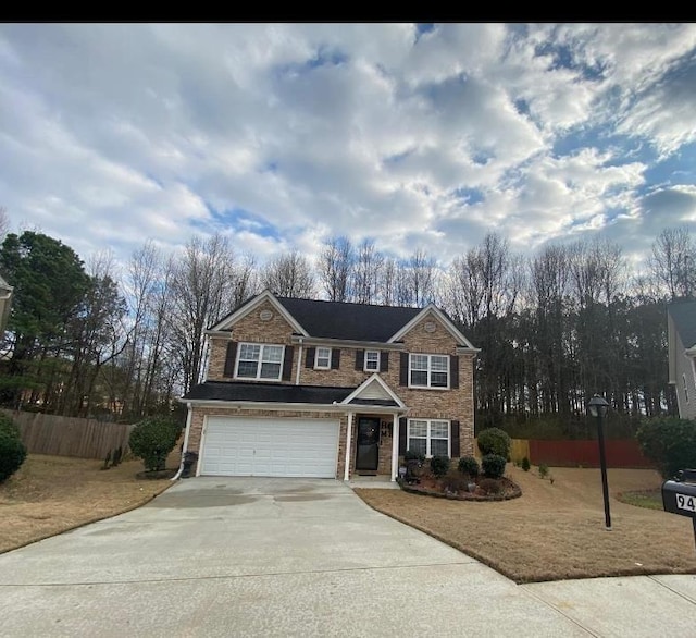 view of front of property featuring a garage