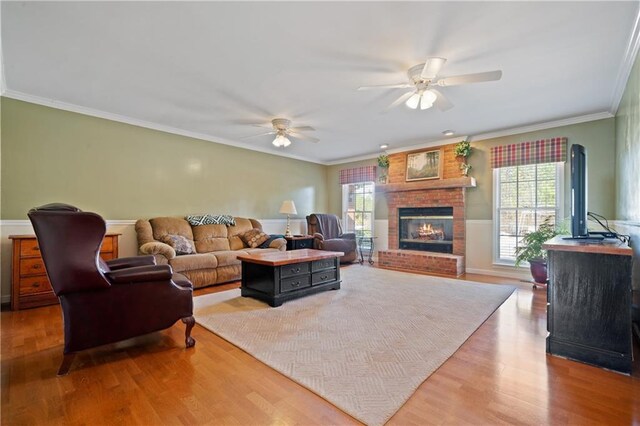 dining area featuring hardwood / wood-style flooring, ceiling fan, and crown molding