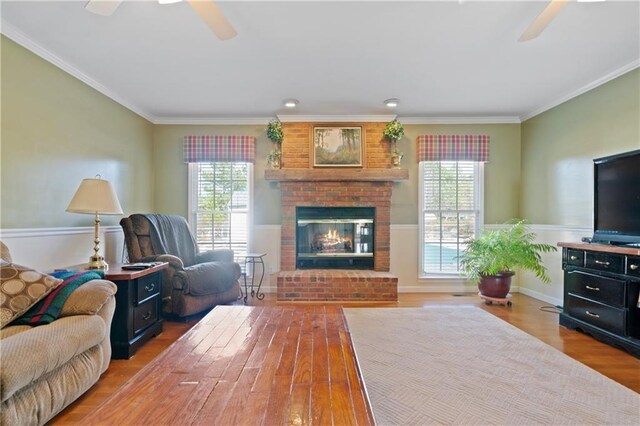 dining space featuring ceiling fan, wood-type flooring, and ornamental molding