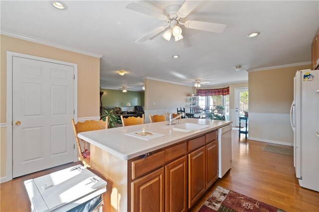 bathroom with toilet, ornamental molding, and walk in shower