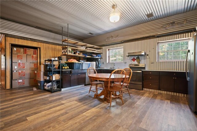 living room featuring a fireplace, light wood-type flooring, ceiling fan, and crown molding