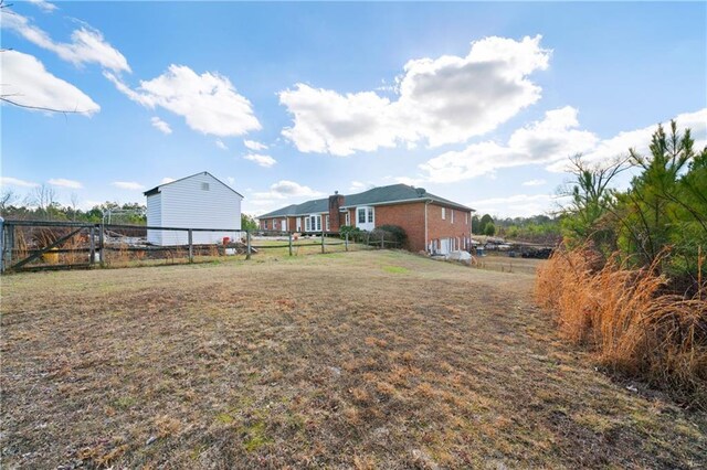 birds eye view of property featuring a rural view