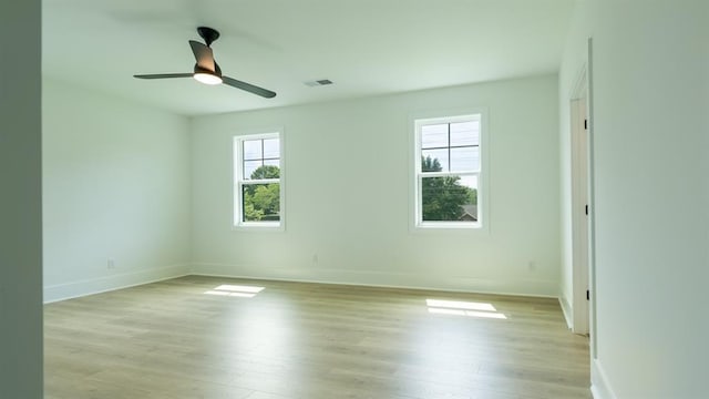 1514 Gatekeeper Ter, Marietta, GA 30066 - spare room featuring light wood-style floors, baseboards, and ceiling fan